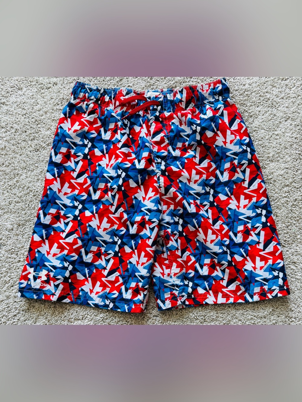 Under Armour youth size XL swim trunks.  Red/white/blue 4th of July!!